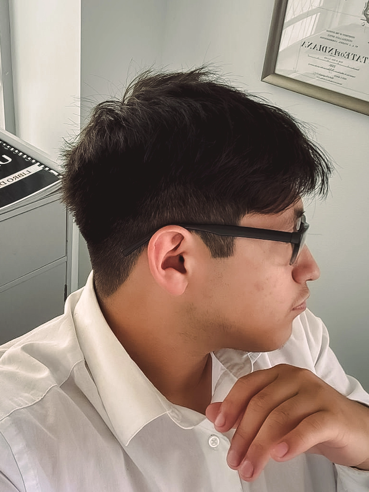 Professional side profile haircut with clean fade